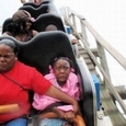 People Riding Roller Coasters