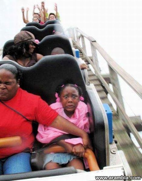 People Riding Roller Coasters